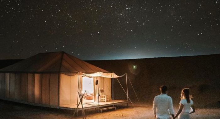 Traditional Berber camp lit up at night in the Erg Chebbi desert